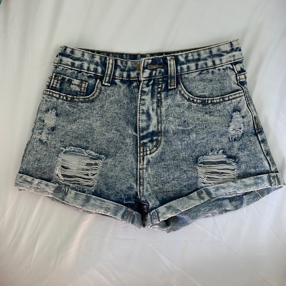 High rise, ripped jean shorts, light blue wash, size 0-2. Barely worn, no stains